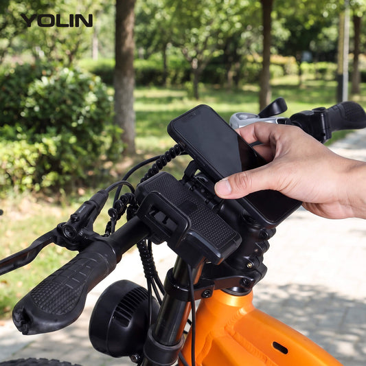 Smartphone placed in Yolin YL-03U e-bike phone mount with USB charging for navigation during ride